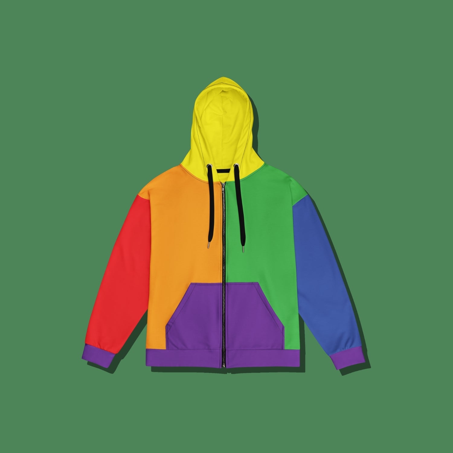 A vibrant colorblock zip-up hoodie with a yellow hood, orange and green front panels, red and blue sleeves, and a purple kangaroo pocket, displayed against a solid green background.