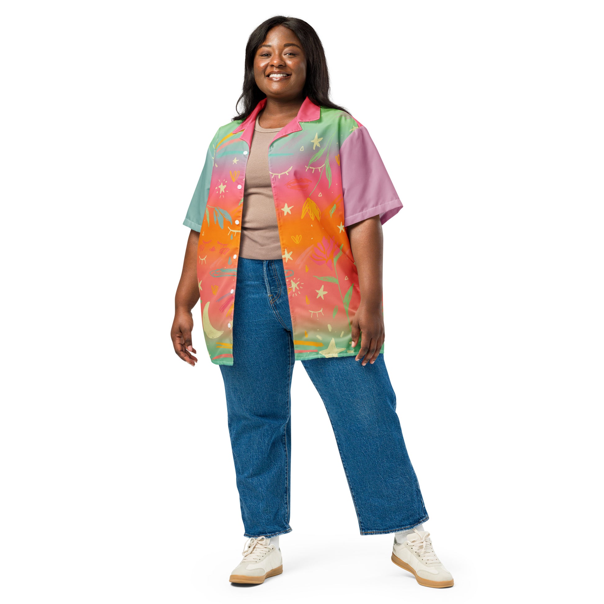 A plus size model with brown skin is wearing a colorful rainbow gradient button down shirt.