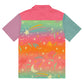 A back view of a rainbow colorful button down shirt with shooting stars, moons, eyelashes, and botanical elements.
