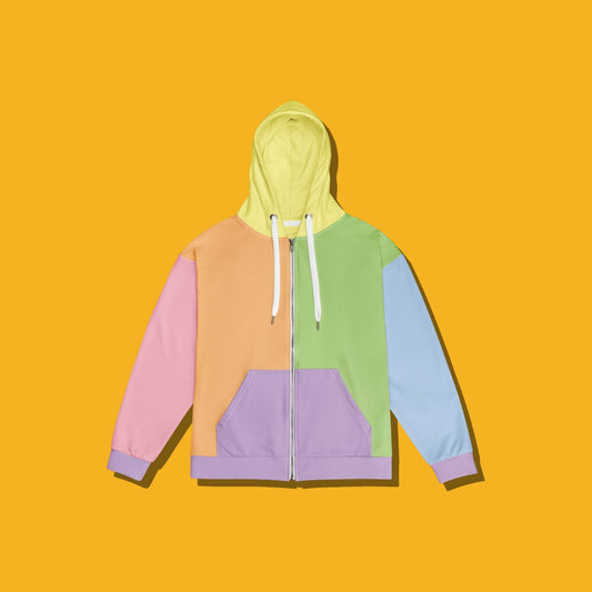 A pastel color-block zip-up hoodie with a hood, displayed flat against a solid yellow background. The hoodie features sections of light green, lavender purple, peach, pink, and light blue, with white drawstrings.