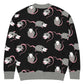 The back view of a cute opossum cardigan sweater with black base and a gray, white, and pink opossum pattern on a white background.